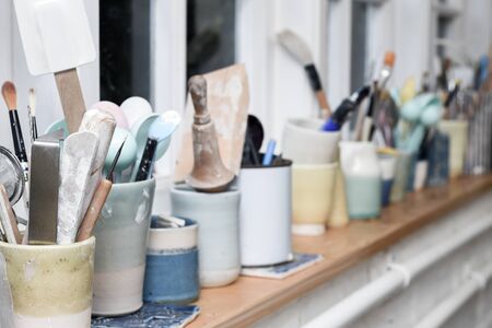 Pottery and ceramics tools for making art and sculpture in a workshopの写真素材
