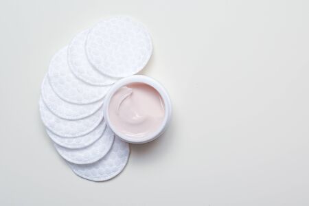 Facial cleansing products and containers with face creams and cotton wool padsの写真素材