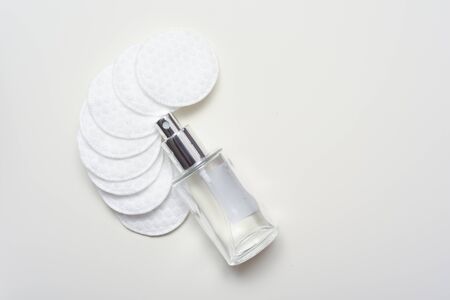 Facial cleansing products and containers with face creams and cotton wool padsの写真素材