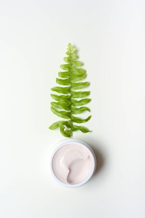 Facial cleansing products and containers with face creams and cotton wool padsの写真素材