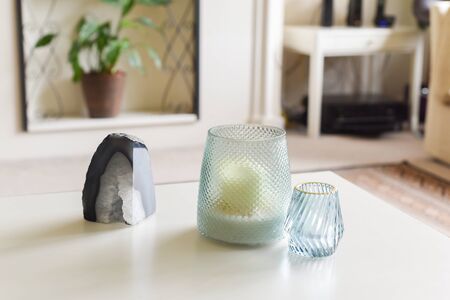 Coffee table in home interior with candle holder objectsの写真素材