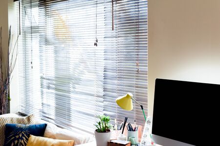 Home working area with office desk set up in living roomの写真素材