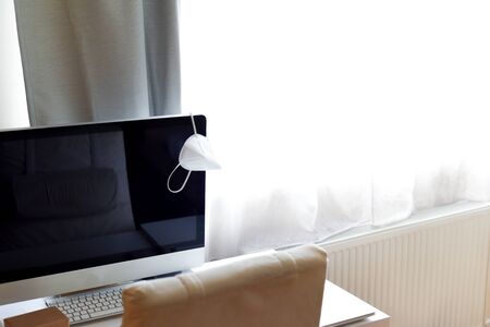 Home working area with office desk set up in a bedroomの写真素材