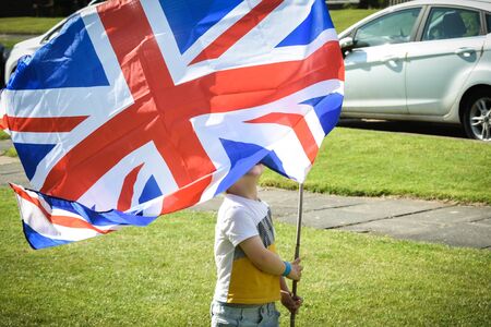 Social distancing whilst celebrating 75th anniversary of VE Day in the UK during a street partyの写真素材