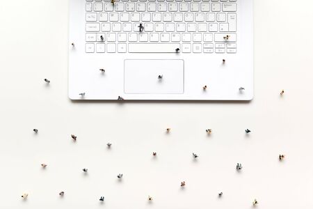 People walking on computer keyboard in concept to show online marketplace for business