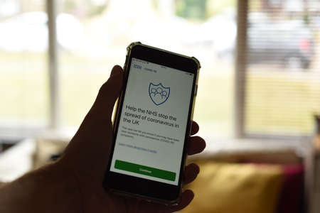 St Albans/ United Kingdom - 5 June 2020: NHS contact tracing app on a phone screen. The  app is due to be rolled out in englandのeditorial素材
