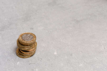 New pound coins from english sterling currency in a pileの写真素材