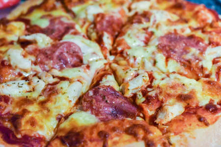 Fresh home made pizza with meats and cheeseの写真素材