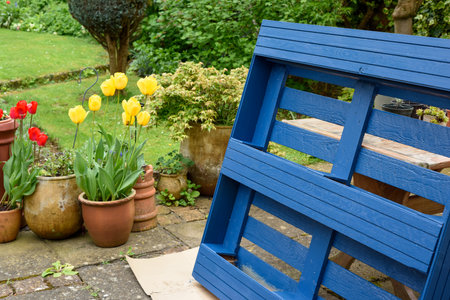 Recycled wooden pallet has been turned into a planter for the garden in an eco friendly upcycling projectの写真素材