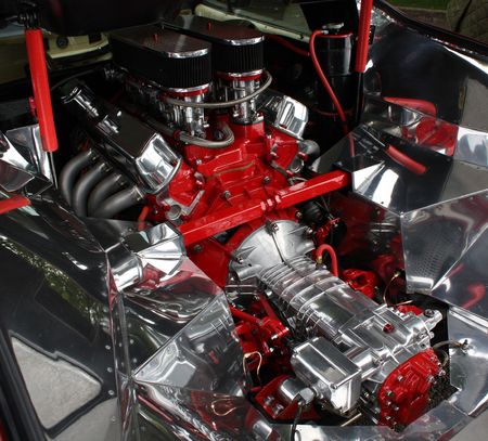 A well-polished red and silver engine in its engine bay