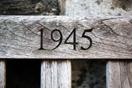 Year 1945 chiselled into grainy woodの写真素材