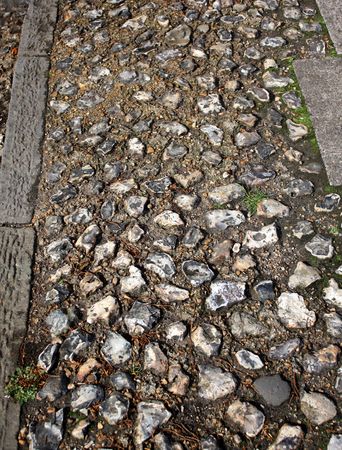 old fashioned pathway made up of flint stonesの写真素材