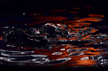 Orange And Silver Wavy Waterの写真素材