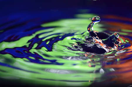 Splash Into Colored Waterの写真素材