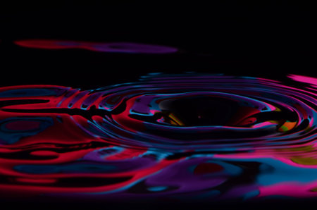 Wavy Blue And Red Water With Black Backgroundの写真素材