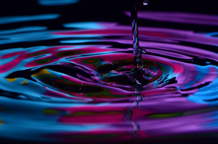 Purple And Blue Water With Stream Of Waterの写真素材