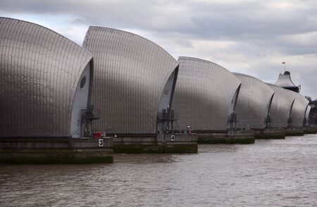 Thames barrier surrounded by dark cloudsの写真素材