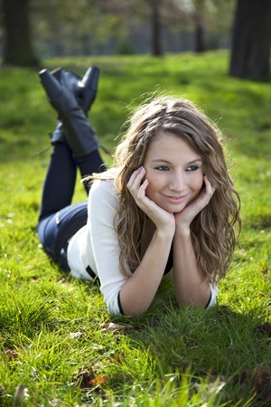 Young woman relaxing on a sunny day in parkの写真素材
