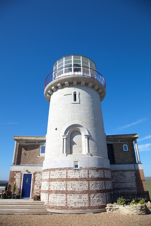 Old white lighthouse on a sunny dayの写真素材