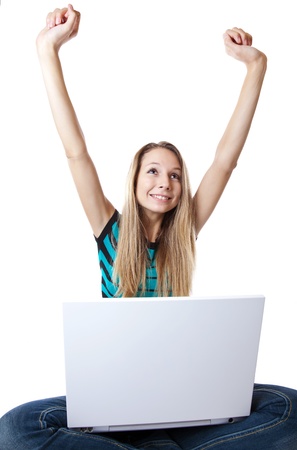 Woman expresses happiness after receiving good news through internetの写真素材