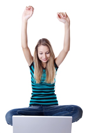 Woman expresses happiness after receiving good news through internetの写真素材
