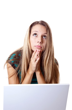 Woman praying that her laptop worksの写真素材
