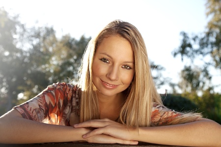 Happy young woman smiling in parkの写真素材