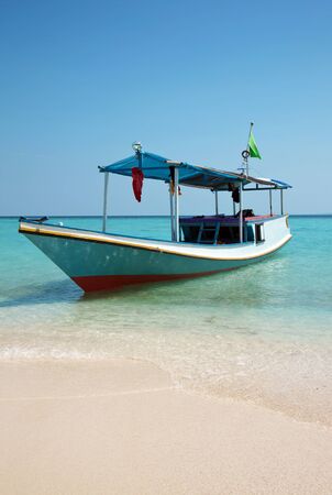 Boat on a beach in Karimunjawa, Indonesiaの写真素材