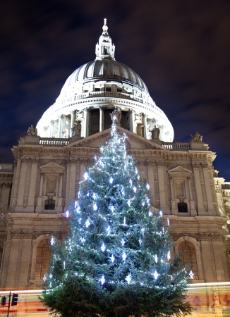 St Paul's cathedral with a christmas tree and bus light trailsの写真素材