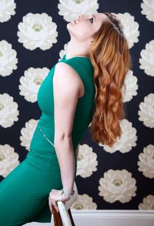 Beauty with red hair looking upの写真素材