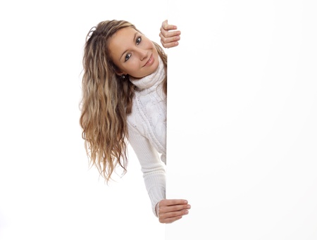 Beautiful woman holding an empty boardの写真素材
