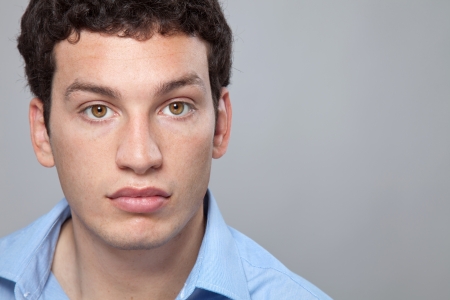 Portait of a young man wearing a shirtの写真素材