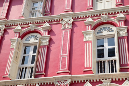 Red building with white windows in Singaporeの写真素材