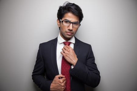 Confident Asian businessman getting readyの写真素材