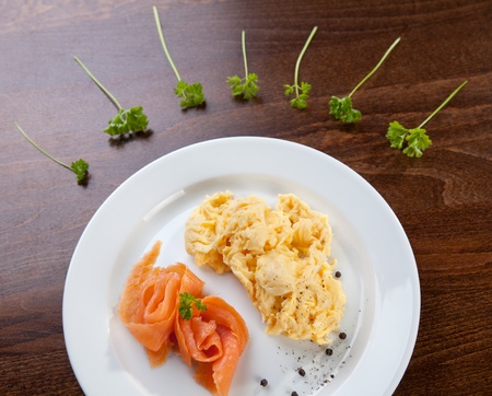 Tasty dish of salmon with scrambled eggsの写真素材