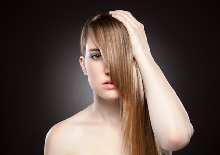 Young beauty with long, elagant and shiny hairの写真素材
