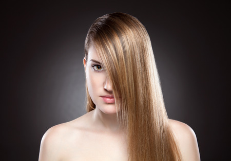 Young beauty with long, elagant and shiny hairの写真素材