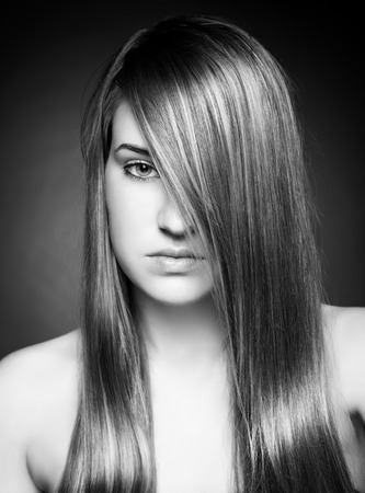 Young beauty with long, elagant and shiny hairの写真素材
