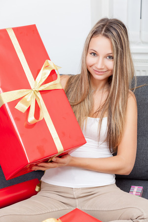 Happy to get that perfect present for Christmasの写真素材