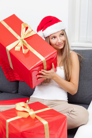 Happy to get that perfect present for Christmasの写真素材
