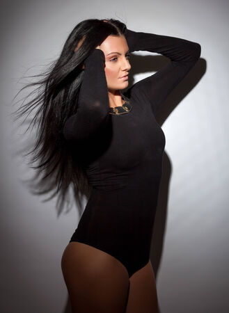 Beautiful young woman with long dark hairの写真素材
