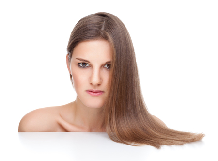 Beautiful young brunette with long straight hairの写真素材
