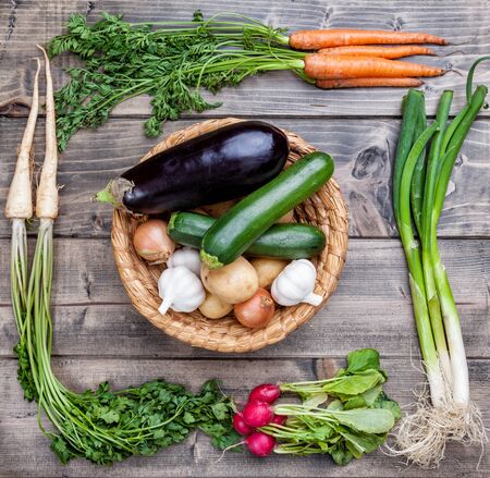 Fresh and organic bio vegetables on a wooden backgroundの写真素材