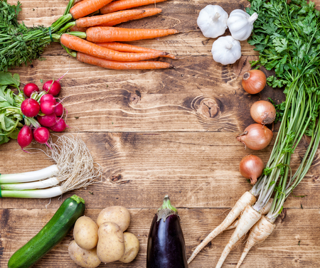Fresh and organic bio vegetables on a wooden backgroundの写真素材