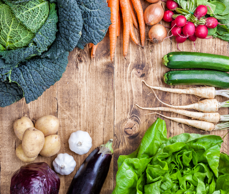 Fresh and organic bio vegetables on a wooden backgroundの写真素材