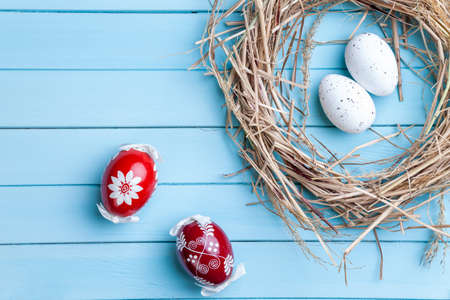 Traditional Easter eggs on a wooden backgroundの写真素材