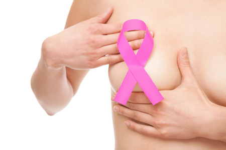 Woman with a pink breast cancer awareness ribbonの写真素材
