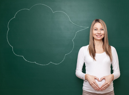 Pregnant woman trying to choose a name for her babyの写真素材