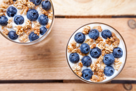 Nutritious and healthy bio yogurt with blueberries and cerealの写真素材