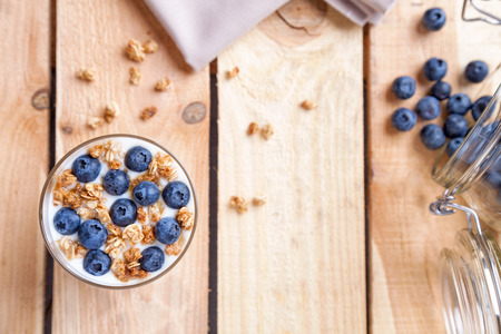 Nutritious and healthy bio yogurt with blueberries and cerealの写真素材